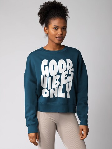 Watapparel Sweatshirt 'Good vibes only ' in Groen: voorkant