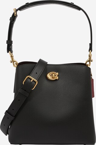 COACH - Bolso de mano en negro: frente