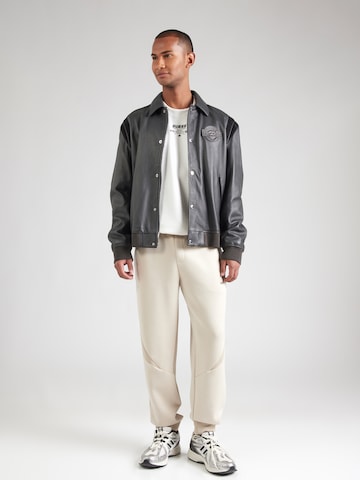 GUESS Tapered Παντελόνι φόρμας 'RYOTA' σε καφέ