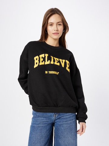 Edikted Sweatshirt 'Believe' in Schwarz: predná strana