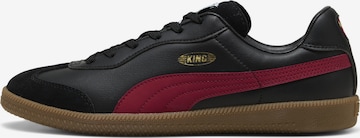 Chaussure de foot 'King 21' PUMA en noir : devant