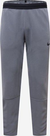 NIKE - Regular Calças de desporto em cinzento: frente