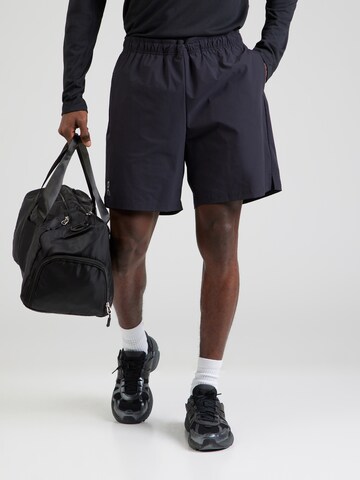 On Loose fit Sports trousers in Black: front