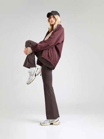 Girlfriend Collective Flared Workout Pants in Brown