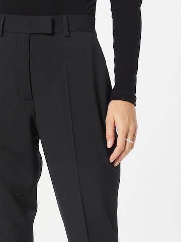Tapered Pantaloni cu dungă de la Calvin Klein pe negru