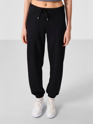 Pantalon Tommy Life en noir : devant