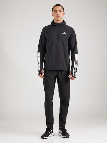 ADIDAS PERFORMANCE Tapered Urheiluhousut 'Own The Run' värissä musta