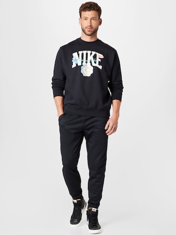 NIKE Tapered Sports trousers in Black