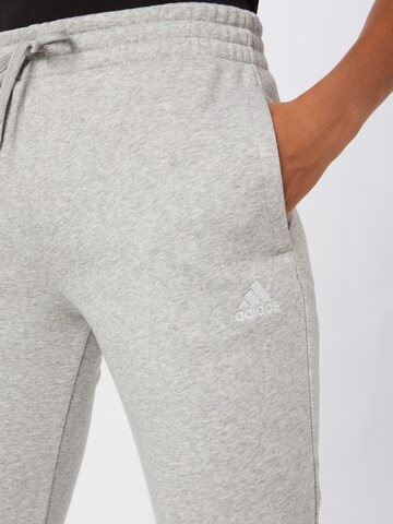 ADIDAS SPORTSWEAR Tapered Workout Pants 'Essentials Fleece Logo' in Grey