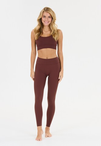 Athlecia Skinny Workout Pants 'Luxe' in Red