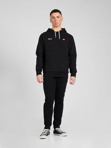 ELLESSE - Ropa para correr 'Traccota' en negro: frente