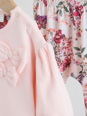 Set Next en rose