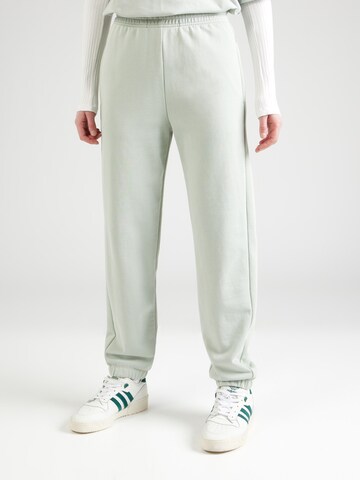 Effilé Pantalon Champion Authentic Athletic Apparel en vert : devant