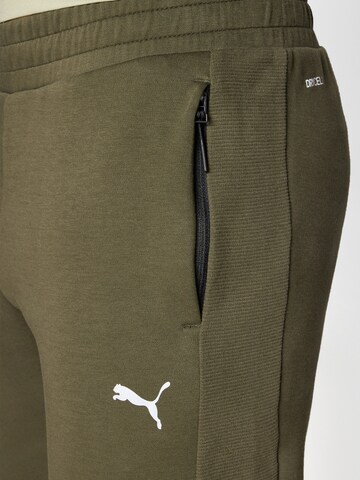 PUMA Slimfit Urheiluhousut 'Evostripe' värissä vihreä