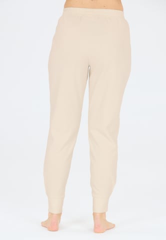 Athlecia Regular Sports trousers in Brown