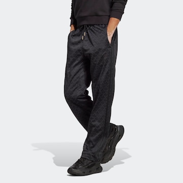 Loosefit Pantaloni 'Graphics Monogram' de la ADIDAS ORIGINALS pe negru: față