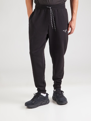 Regular Pantaloni sport de la PUMA pe negru: față