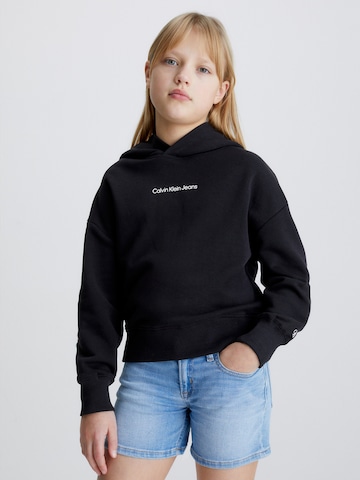 Sweat-shirt Calvin Klein Jeans en noir : devant