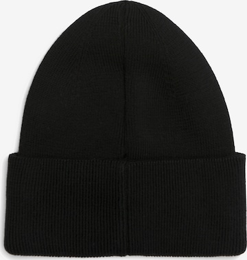 juoda Calvin Klein Megzta kepurė