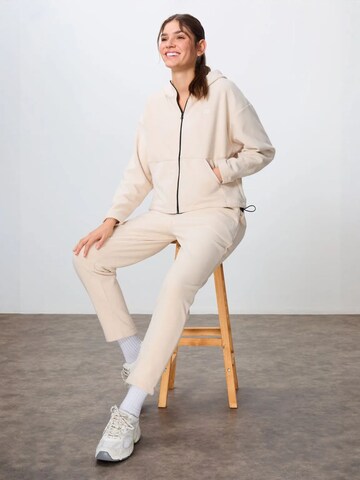 Tommy Life Tracksuit in Beige: front