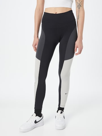 NIKE Skinny Workout Pants in Black: front