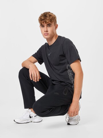 NIKE Sportshirt 'Burnout' in Schwarz