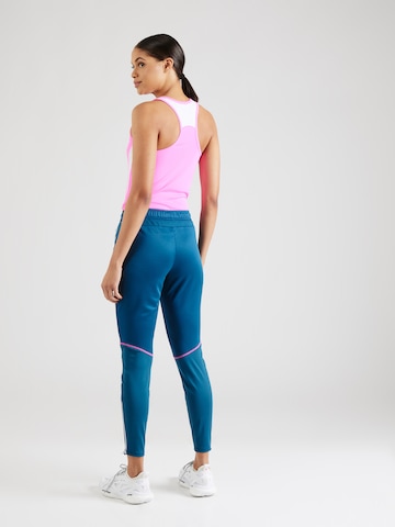 PUMA Tapered Sportbroek 'Individual BLAZE' in Blauw