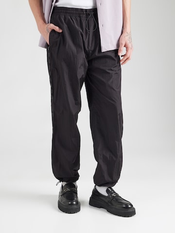Tapered Pantaloni di Versace Jeans Couture in nero: frontale