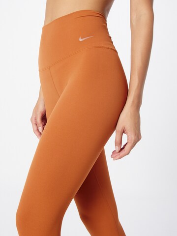 NIKE Skinny Sportbroek 'ZENVY' in Oranje