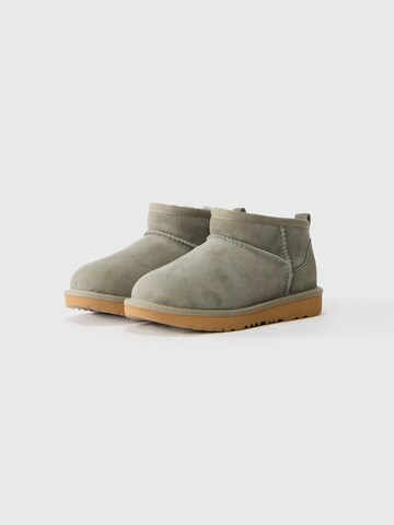 Bocanci de zăpadă 'CLASSIC ULTRA MINI' de la UGG pe verde