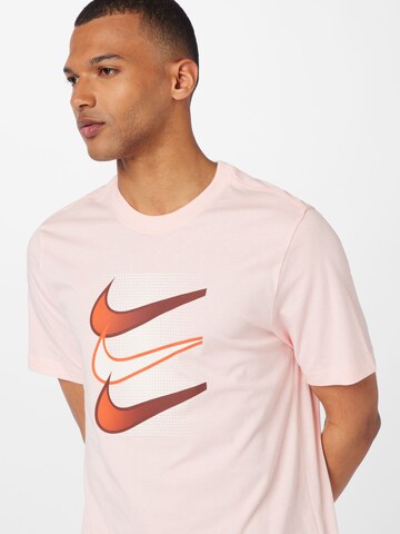 T-Shirt 'SWOOSH' Nike Sportswear en rose