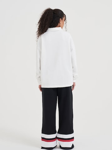 AND1 Loosefit Hose in Schwarz