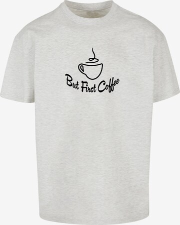 Merchcode Shirt 'But First Coffee' in Grijs: voorkant