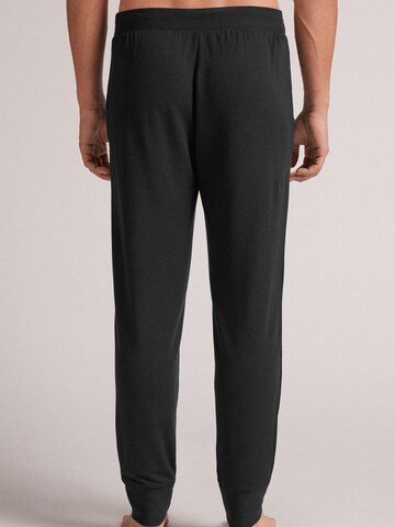 INTIMISSIMI Tapered Hose in Schwarz