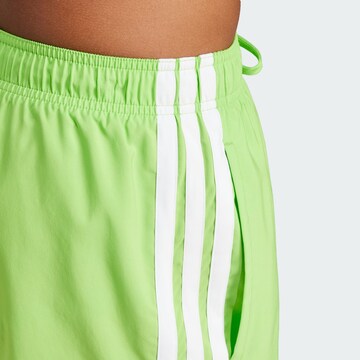 ADIDAS SPORTSWEAR Board shorts in Green