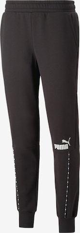 PUMA - Pantalón deportivo en negro: frente