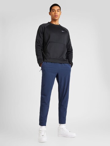 NIKE Tapered Workout Pants 'UNLIMITED' in Blue