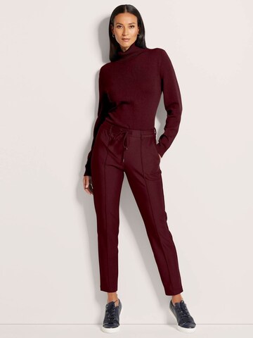 MADELEINE Slim fit Trousers in Red: front
