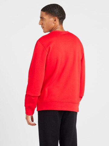 Felpa di Champion Authentic Athletic Apparel in rosso