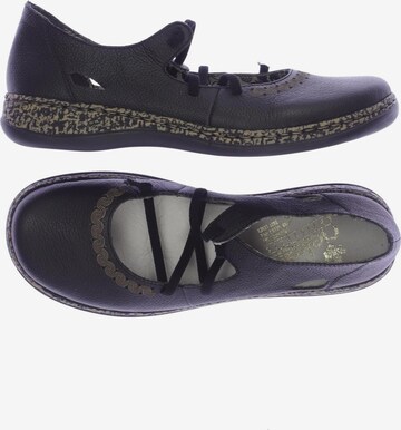 Rieker Flats & Loafers in 39 in Black: front