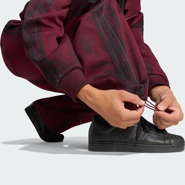 Wide leg Pantaloni 'Adilenium 6' di ADIDAS ORIGINALS in rosso