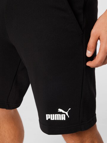 PUMA - Regular Calças de desporto 'Essentials' em preto