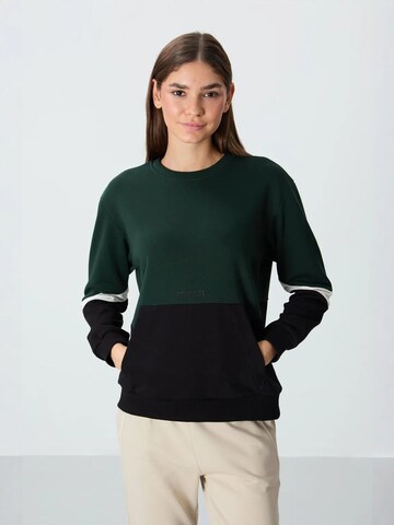 Sweat-shirt Tommy Life en vert : devant