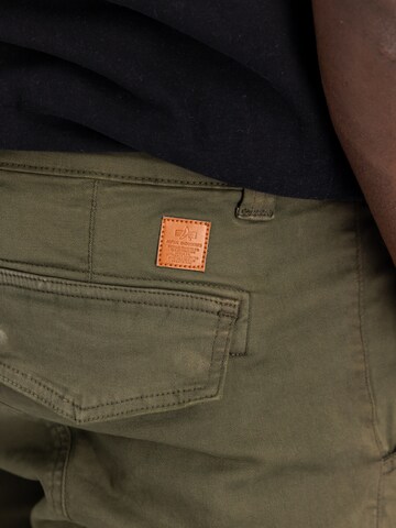 ALPHA INDUSTRIES - Tapered Pantalón cargo 'Petrol Patch' en verde