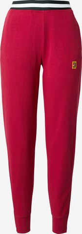 Effilé Pantalon de sport NIKE en rouge : devant