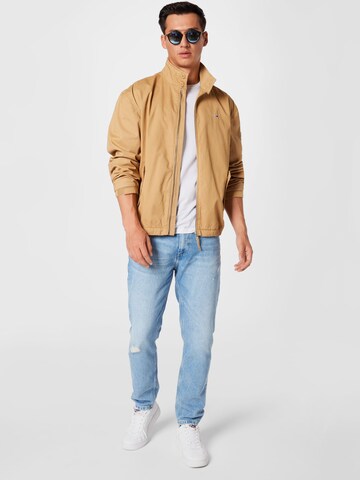 Tommy Jeans Välikausitakki 'MODERN HARRINGTON' värissä beige