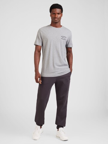 Champion Authentic Athletic Apparel Tapered Trousers in Grey