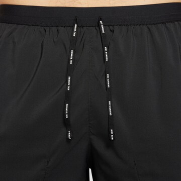 NIKE Regular Sports trousers 'Flex Stride' in Black