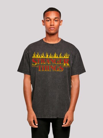 F4NT4STIC Shirt 'Stranger Things Fire Logo Men Netflix TV Series' in Black: front