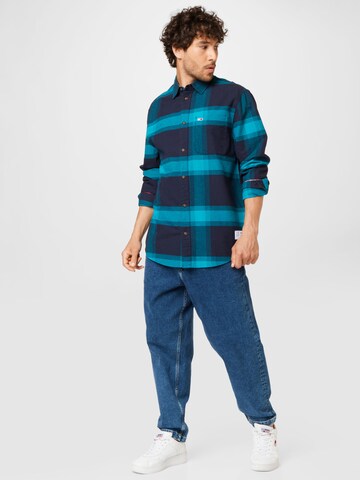 Tommy Jeans Loosefit Pressveckade jeans 'BAX' i blå
